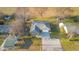Aerial view of a well-maintained home showcasing its manicured lawn and inviting curb appeal at 15620 E State Road 46, Columbus, IN 47203