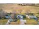 Aerial shot of the property and its surroundings with a long driveway in a rural neighborhood at 15620 E State Road 46, Columbus, IN 47203