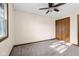 Bright bedroom features plush carpet, fresh paint, and a large double-door closet for ample storage at 15620 E State Road 46, Columbus, IN 47203