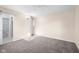 Bright bedroom with neutral walls and plush carpet at 15620 E State Road 46, Columbus, IN 47203