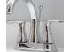 Close-up of a chrome faucet with dual handles on a white sink at 15620 E State Road 46, Columbus, IN 47203