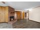 Inviting living room featuring a brick fireplace and neutral walls at 15620 E State Road 46, Columbus, IN 47203