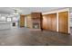 Open concept living room with views into renovated kitchen and brick fireplace at 15620 E State Road 46, Columbus, IN 47203