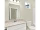 Well-lit bathroom with a modern vanity, framed mirror, and a clean, functional layout for everyday convenience at 1603 Clover Crossing Dr # 1A, Greenfield, IN 46140