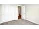 Comfortable bedroom with closet and neutral carpet, offering ample storage and a serene, uncluttered atmosphere at 1603 Clover Crossing Dr # 1A, Greenfield, IN 46140