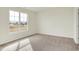 This bedroom has neutral carpeting, a large window for lots of light and fresh neutral paint at 1603 Clover Crossing Dr # 1A, Greenfield, IN 46140