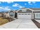Lovely home with a two-car garage and stone veneer accents, set on a partially landscaped lot at 1603 Clover Crossing Dr # 1A, Greenfield, IN 46140