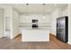 Contemporary kitchen with white cabinets, a center island, and stainless steel appliances at 1603 Clover Crossing Dr # 1A, Greenfield, IN 46140