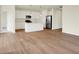 Bright, open living space with hardwood floors, a kitchen island, and stainless steel appliances at 1603 Clover Crossing Dr # 1A, Greenfield, IN 46140
