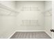 Carpeted walk in closet with wire shelving at 1603 Clover Crossing Dr # 1A, Greenfield, IN 46140
