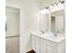 Bright bathroom boasts double sinks, white cabinets, and modern fixtures at 1609 Clover Crossing Dr, Greenfield, IN 46140