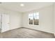 Bright bedroom features neutral carpet, pale walls, and a large window at 1609 Clover Crossing Dr, Greenfield, IN 46140