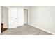 Carpeted bedroom with closet and view into another room at 1609 Clover Crossing Dr, Greenfield, IN 46140