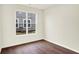 Bright bedroom with wood-look flooring and a large window at 1609 Clover Crossing Dr, Greenfield, IN 46140