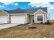 Charming single Gathering house featuring an attached garage and a well-maintained lawn at 1609 Clover Crossing Dr, Greenfield, IN 46140