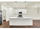 Bright kitchen with island, white cabinets, modern appliances, and an open layout perfect for entertaining at 1609 Clover Crossing Dr, Greenfield, IN 46140