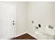 Functional laundry room featuring a utility sink, and a door to the exterior at 1609 Clover Crossing Dr, Greenfield, IN 46140