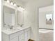 Bright bathroom features a double sink vanity and view to bedroom with natural light at 1615 Clover Crossing Dr # 2A, Greenfield, IN 46140
