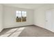 Comfortable bedroom with carpet, a window, and a neutral color scheme at 1615 Clover Crossing Dr # 2A, Greenfield, IN 46140