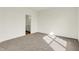 Well-lit bedroom with carpet, large window, and an adjacent bathroom at 1615 Clover Crossing Dr # 2A, Greenfield, IN 46140