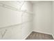 Walk-in closet features wire shelving for organized storage at 1615 Clover Crossing Dr # 2A, Greenfield, IN 46140