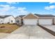 Charming home featuring attached two car garage, neutral siding, and manicured lawn at 1615 Clover Crossing Dr # 2A, Greenfield, IN 46140
