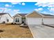 Charming home featuring attached two car garage, neutral siding, and manicured lawn at 1615 Clover Crossing Dr # 2A, Greenfield, IN 46140
