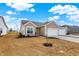Charming home featuring attached two car garage, neutral siding, and space for landscaping at 1615 Clover Crossing Dr # 2A, Greenfield, IN 46140