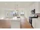 Modern kitchen featuring an island, stainless appliances, recessed lighting, and hardwood flooring at 1615 Clover Crossing Dr # 2A, Greenfield, IN 46140