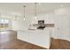 Modern kitchen featuring an island, stainless appliances, recessed lighting, and hardwood flooring at 1615 Clover Crossing Dr # 2A, Greenfield, IN 46140