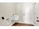 Functional laundry room features a sink and a door to the exterior at 1615 Clover Crossing Dr # 2A, Greenfield, IN 46140