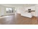 Open-concept living room with abundant natural light and beautiful hardwood floors at 1615 Clover Crossing Dr # 2A, Greenfield, IN 46140