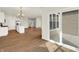 Open-concept living area with hardwood floors and sliding glass door to the backyard at 1615 Clover Crossing Dr # 2A, Greenfield, IN 46140