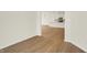 Bright living area showcases hardwood floors and open access to the kitchen at 1615 Clover Crossing Dr # 2A, Greenfield, IN 46140
