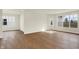 Spacious living room area filled with natural light and hardwood flooring at 1615 Clover Crossing Dr # 2A, Greenfield, IN 46140