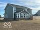 Backyard featuring a well-maintained lawn and a modern two-story home, perfect for outdoor activities at 1670 Crossley St, Fortville, IN 46040