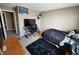 This bedroom features carpet, a desk area and an inviting black comforter on the bed at 1670 Crossley St, Fortville, IN 46040