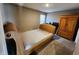 Neutral bedroom featuring carpet, a bed frame and natural light from the window at 1670 Crossley St, Fortville, IN 46040