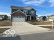 Inviting two-story home featuring a two-car garage and a freshly paved driveway at 1670 Crossley St, Fortville, IN 46040