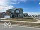 Charming two-story home with a well-manicured lawn in a friendly neighborhood setting at 1670 Crossley St, Fortville, IN 46040
