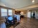Open-concept kitchen with island, stainless steel appliances, and a breakfast nook with natural light at 1670 Crossley St, Fortville, IN 46040