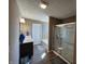 Bright bathroom with a walk-in shower, bathtub, and a modern vanity with a sink at 1670 Crossley St, Fortville, IN 46040