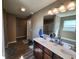 This main bathroom features a dual sink vanity, large mirror, and modern fixtures at 1670 Crossley St, Fortville, IN 46040
