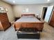 Beautifully furnished main bedroom featuring wood accents, soft carpeting, and warm decor at 1670 Crossley St, Fortville, IN 46040