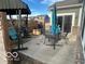 Relaxing outdoor patio featuring a swing, dining set, and grill perfect for enjoying sunny days at 1670 Crossley St, Fortville, IN 46040