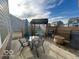 Inviting outdoor patio with a swing, dining set, and grill, ideal for enjoying outdoor living at 1670 Crossley St, Fortville, IN 46040
