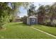 View of the backyard showing the outbuilding and grassy area at 1817 Medford Ave, Indianapolis, IN 46222