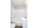 Bathroom featuring a shower-tub combination and white vanity sink at 1817 Medford Ave, Indianapolis, IN 46222