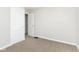 Empty bedroom with light-colored carpet and paint, featuring ample closet space at 1817 Medford Ave, Indianapolis, IN 46222