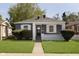 Charming home with blue siding, white trim, and manicured lawn at 1817 Medford Ave, Indianapolis, IN 46222